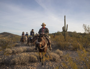riders on a trail ride in the desert at Kay El Bar Guest Ranch
