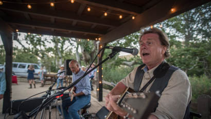 People singing and playing music on stage at Alisal Guest Ranch