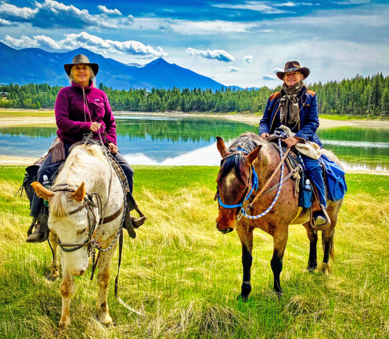 Two Ladies on horseback at the lake