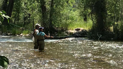 Guests fly fishing at Colorado Trail Ranch