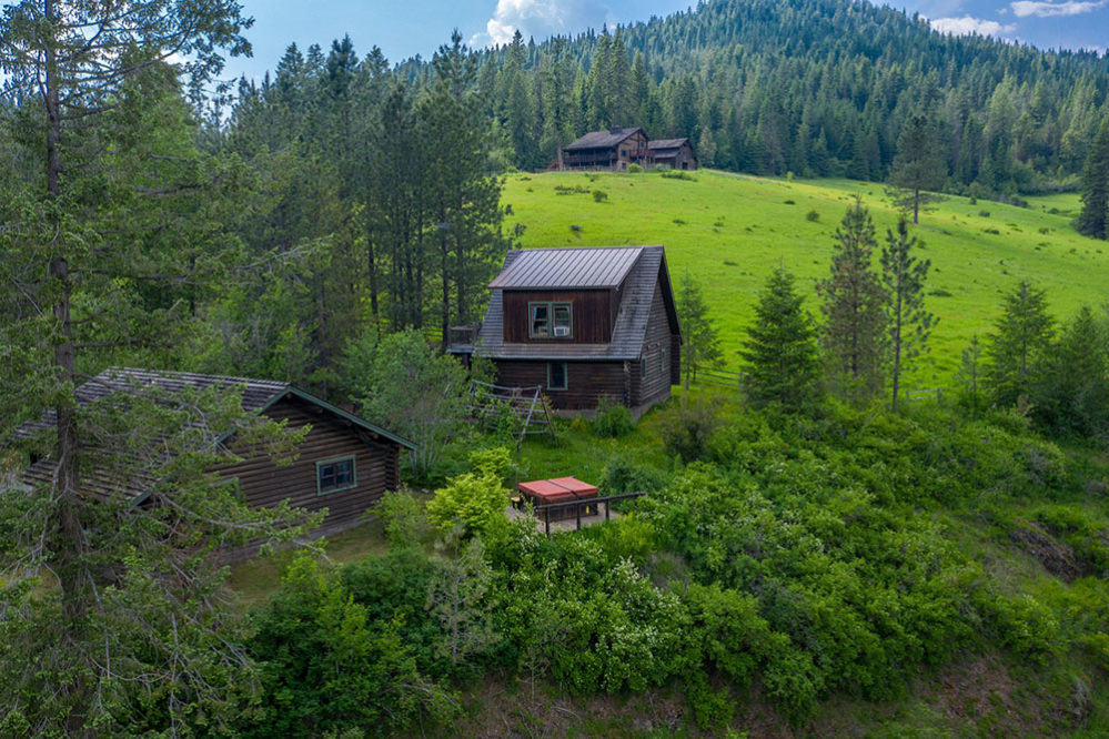 Red Horse Mountain Ranch cabins on green hillside