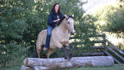Woman jumping a horse bareback at Rocking Z Ranch