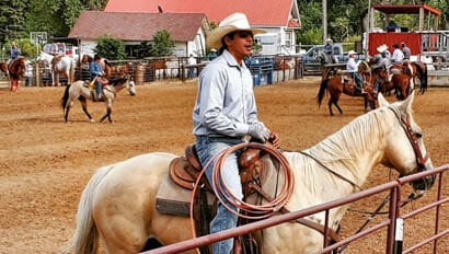 Cowboy in an arena at Eatons' Ranch