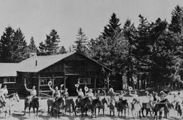 Historical photo of guests on horses