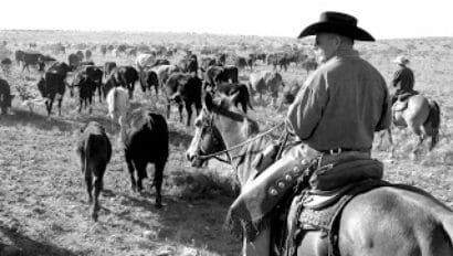 Burnt Well Ranch man on horse black and white