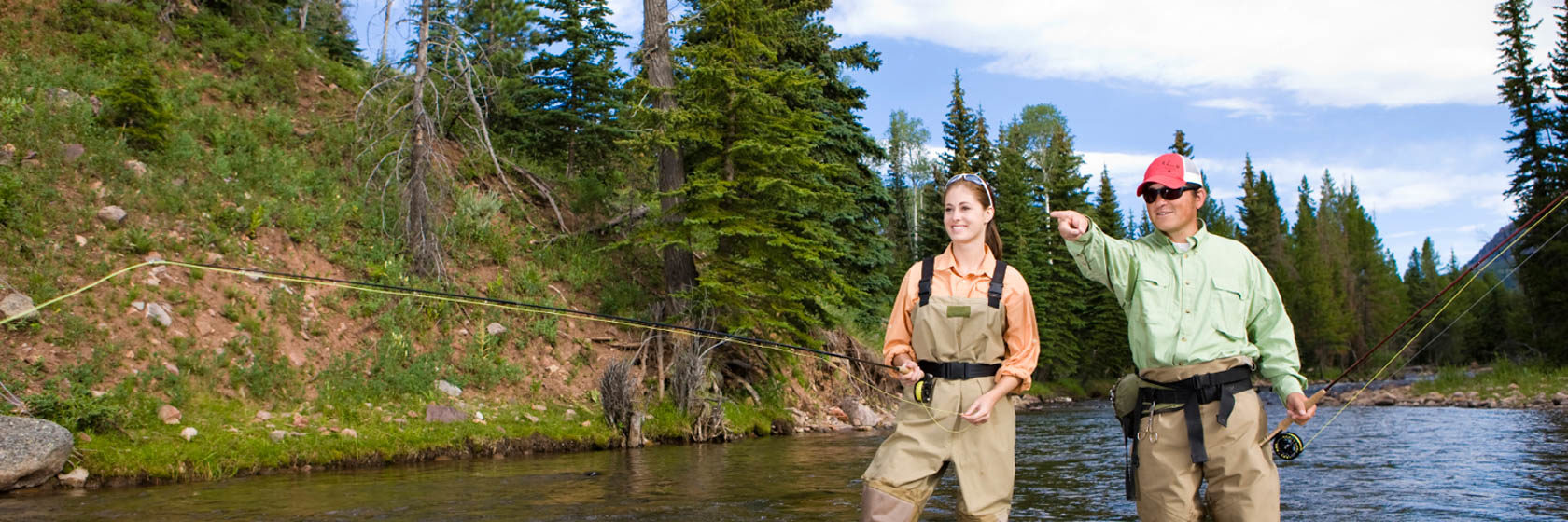 Two people fly fishing at C Lazy U Ranch