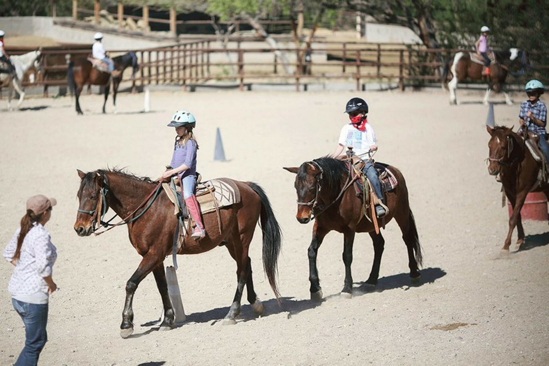 kids riding horses