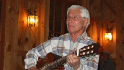 Dick Elder playing guitar