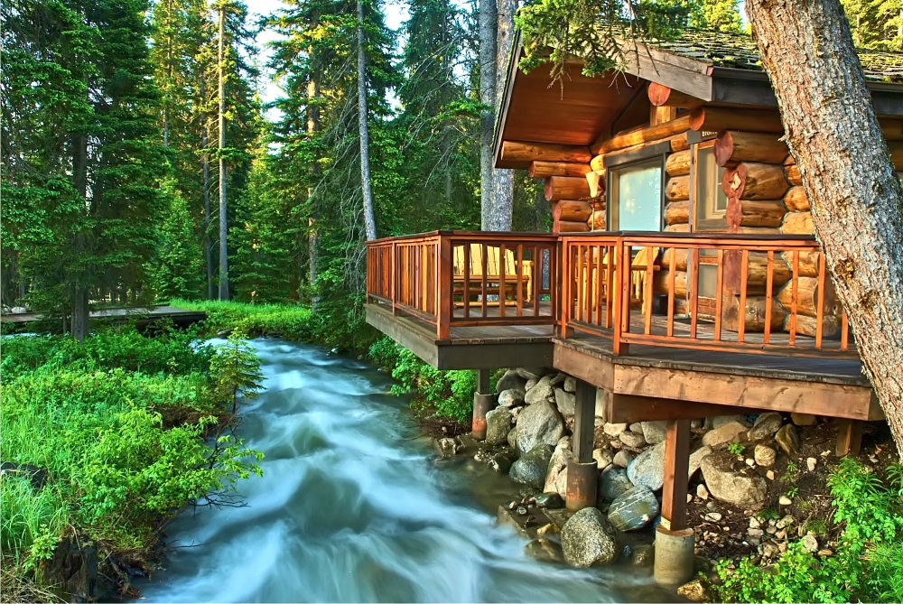 cabin with flowing river