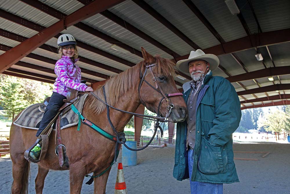 Grandparent with Grandchild on horse