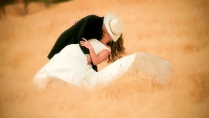couple kissing at dude ranch wedding