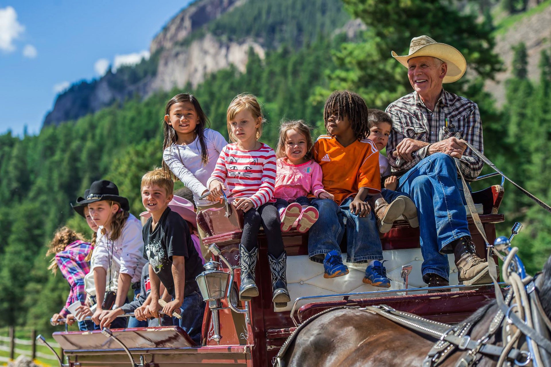 kids riding on a wagon