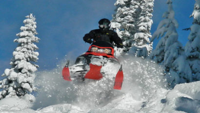 snowmobile jumping snow