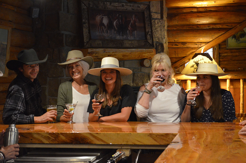 shoshone lodge and guest ranch guests at bar