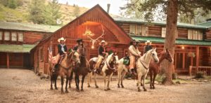 Riders in front of main lodge at Shoshone Lodge