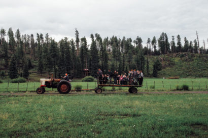 guests on a hayride at Sprucedale Guest Ranch