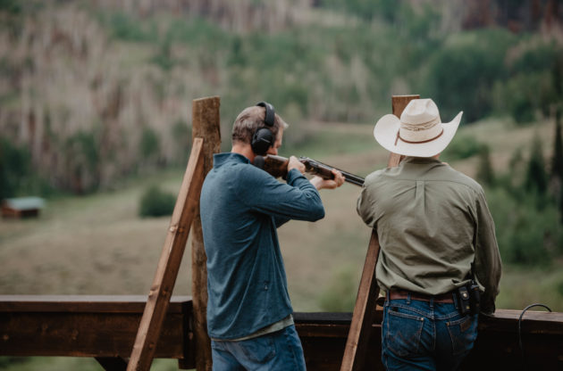 2 men at a shooting range
