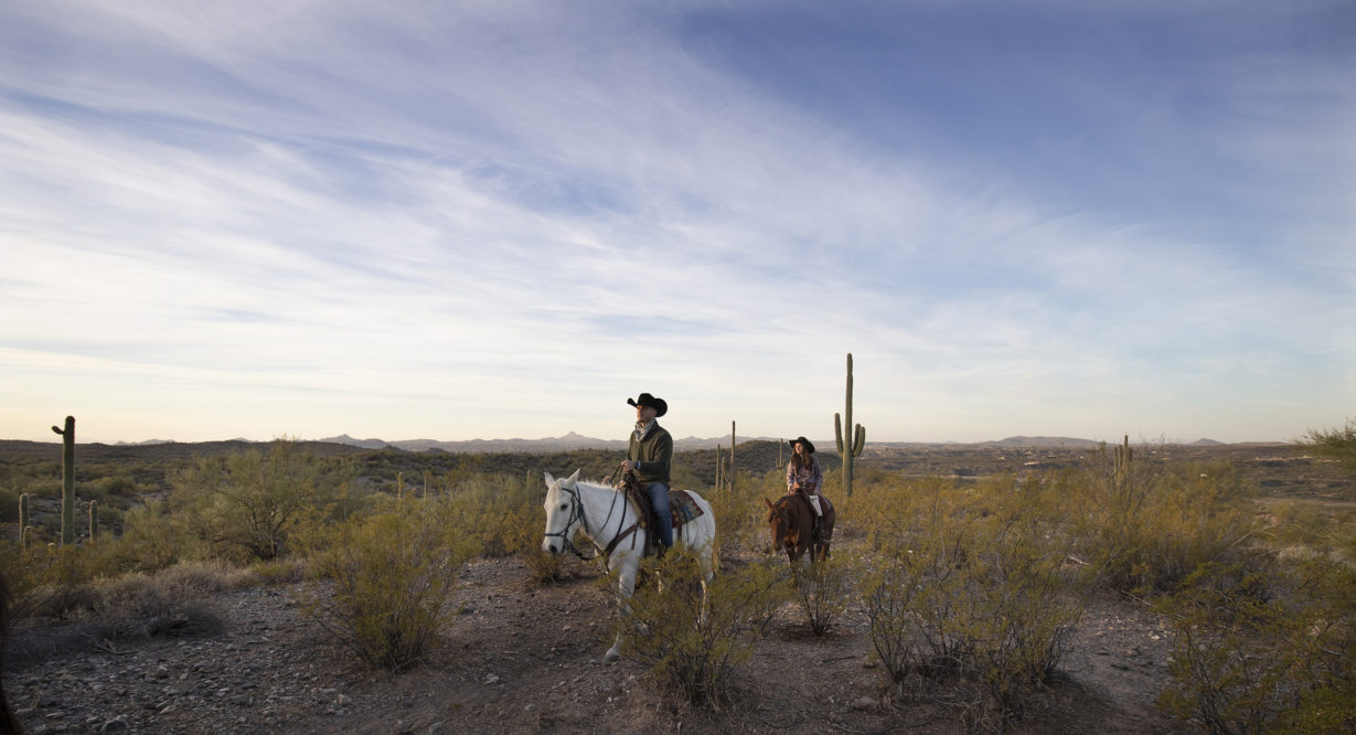 riders in the desert at Kay El Bar Guest Ranch