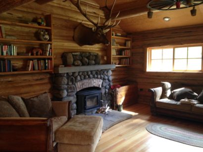 7d fireplace in cabin with bull elk on wall