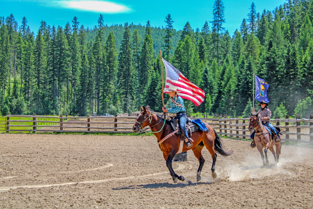 Wranglers Carrying Flags at Bar W