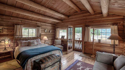 Cabin bedroom at Flat Creek Ranch