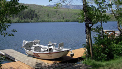 Boat on dock at fishing lake at Hubbards Ranch
