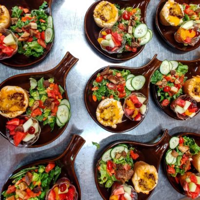 individual salads in wooden bowls very colorful