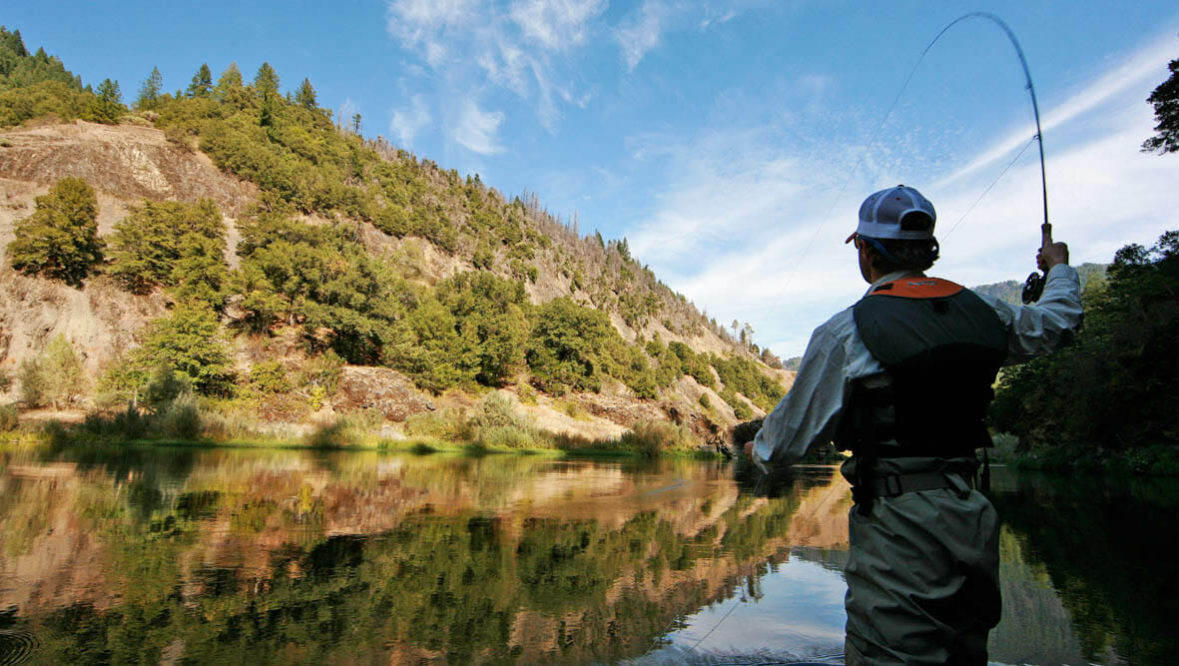 Man fly fishing at Marble Mountain Ranch