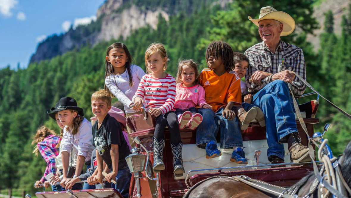 Wagon ride with kids at Rainbow Trout Ranch