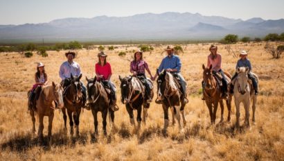 group on horses in dessert