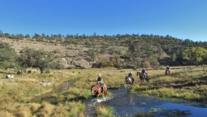 Riders crossing a creek