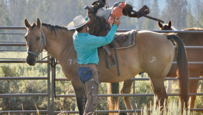 wayne saddling up a horse