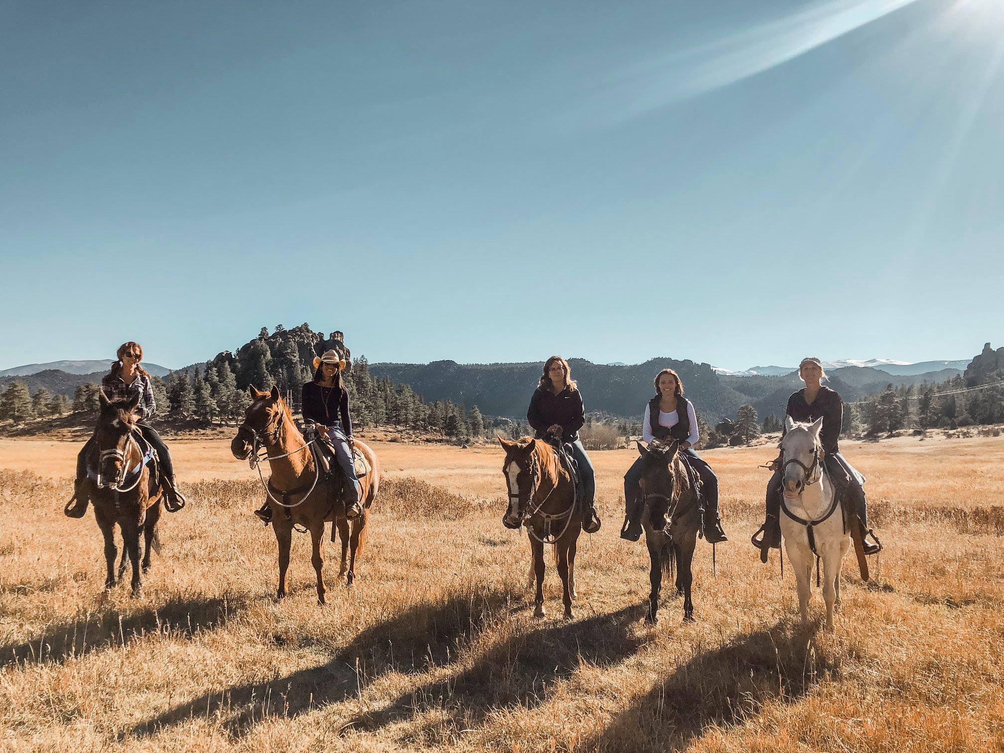 group of people on horses