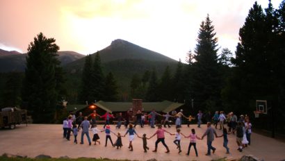 people holding hands in a circle