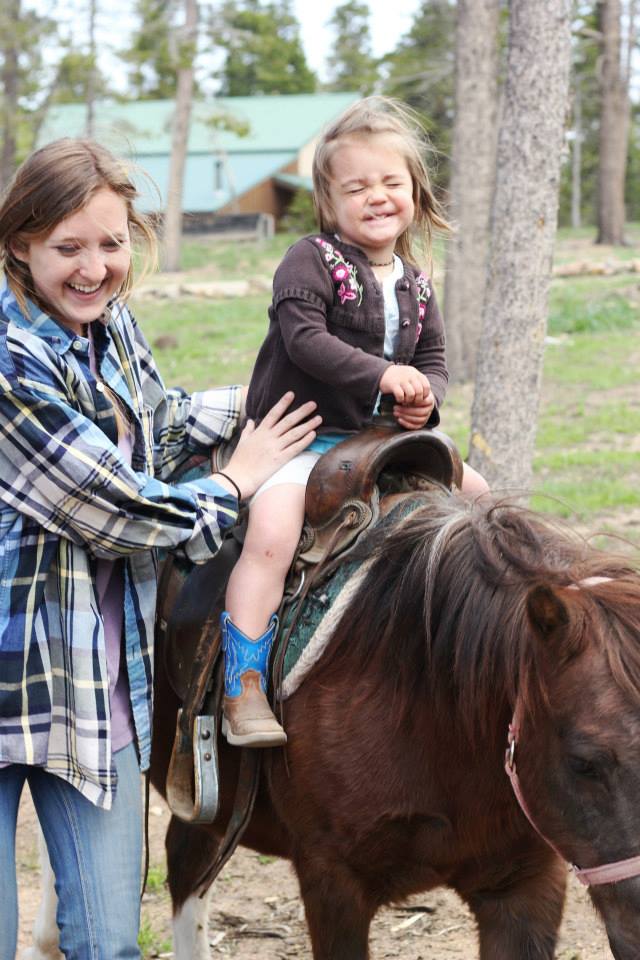 Wind River Ranch Baby Riding a Pony