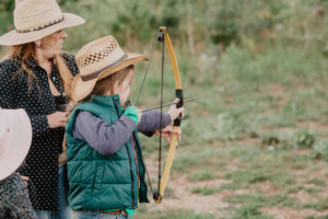 kid with bow and arrow